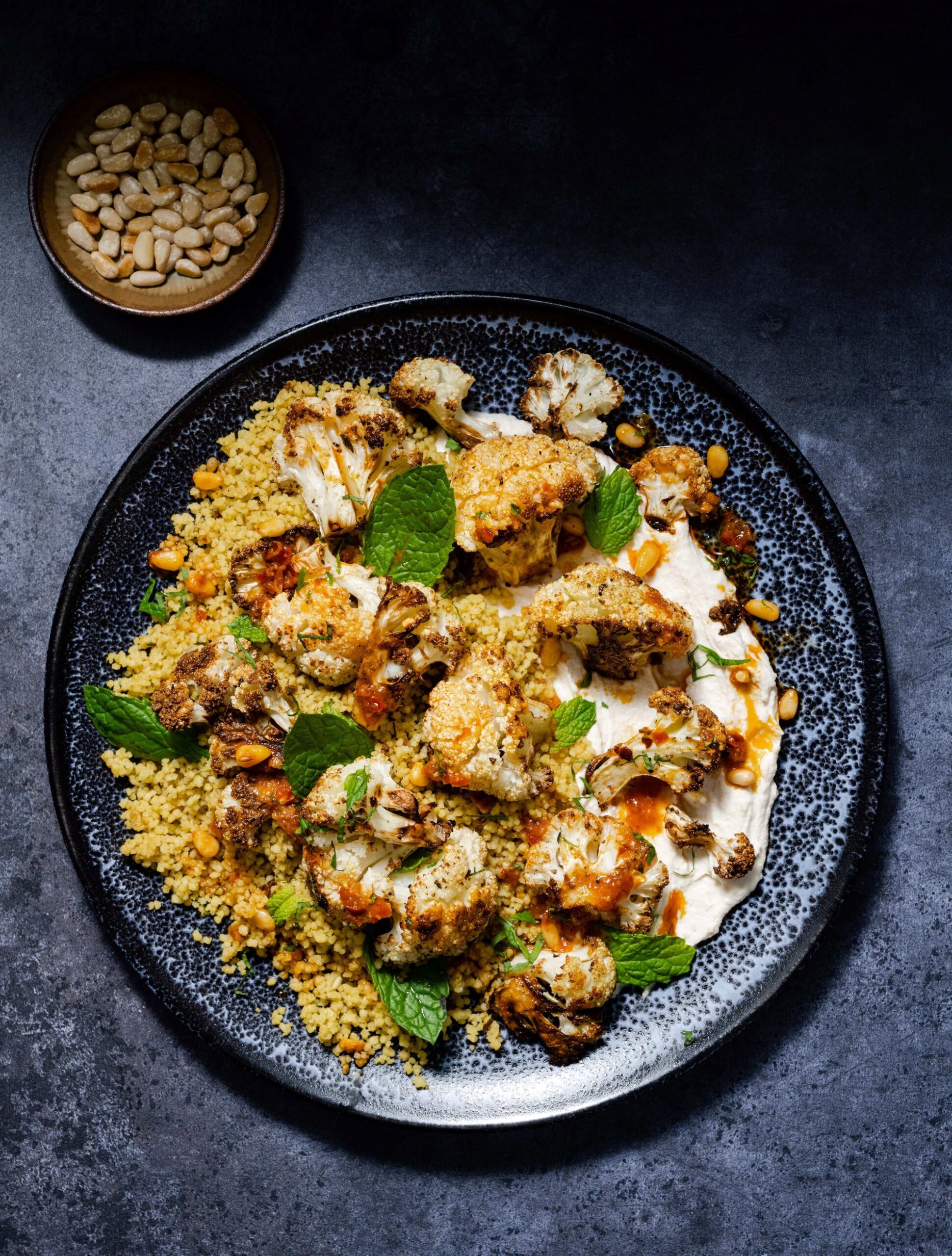 Roasted Spiced Cauliflower with Couscous, Tahini and a Harissa, Lemon & Pine Nut Dressing - Ainsley 